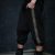 Men loose pants made from cotton lycra fabric, designed with 2 golden stripes